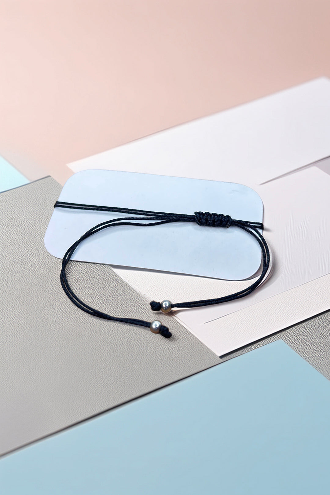 Minimalistic bracelet with pearl ends on display