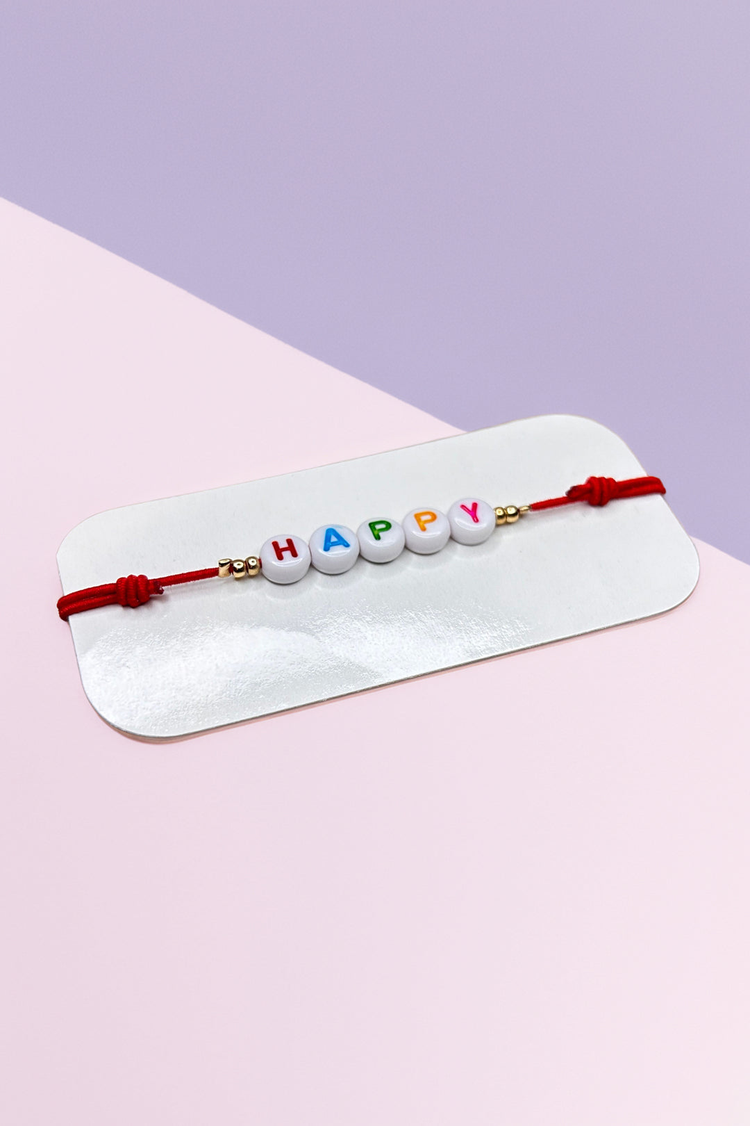 Colorful 'Happy' beaded bracelet on display card