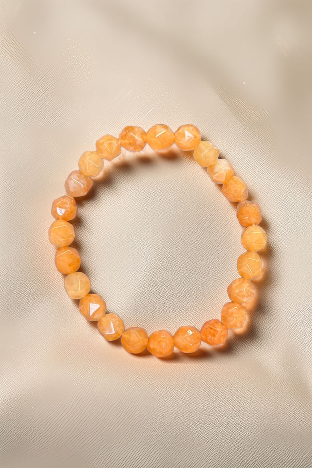 Sun-Kissed Orange Beaded Bracelet on neutral background
