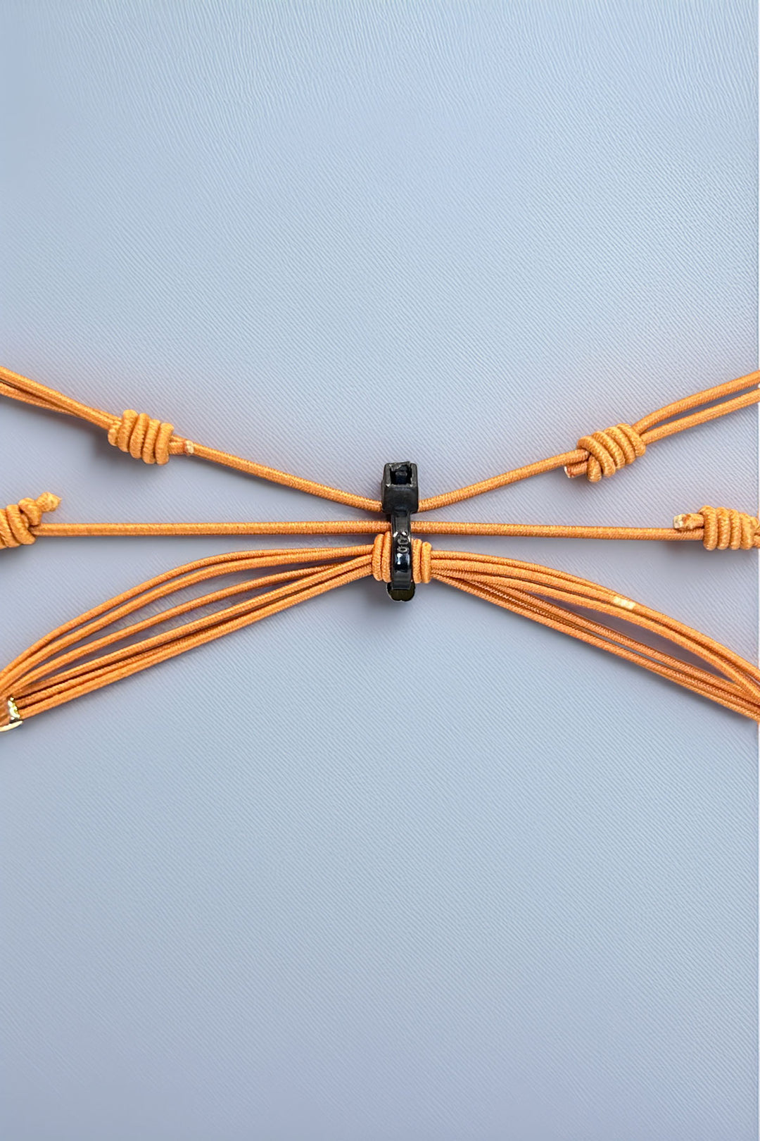 Back view of adjustable triple bracelet set closure
