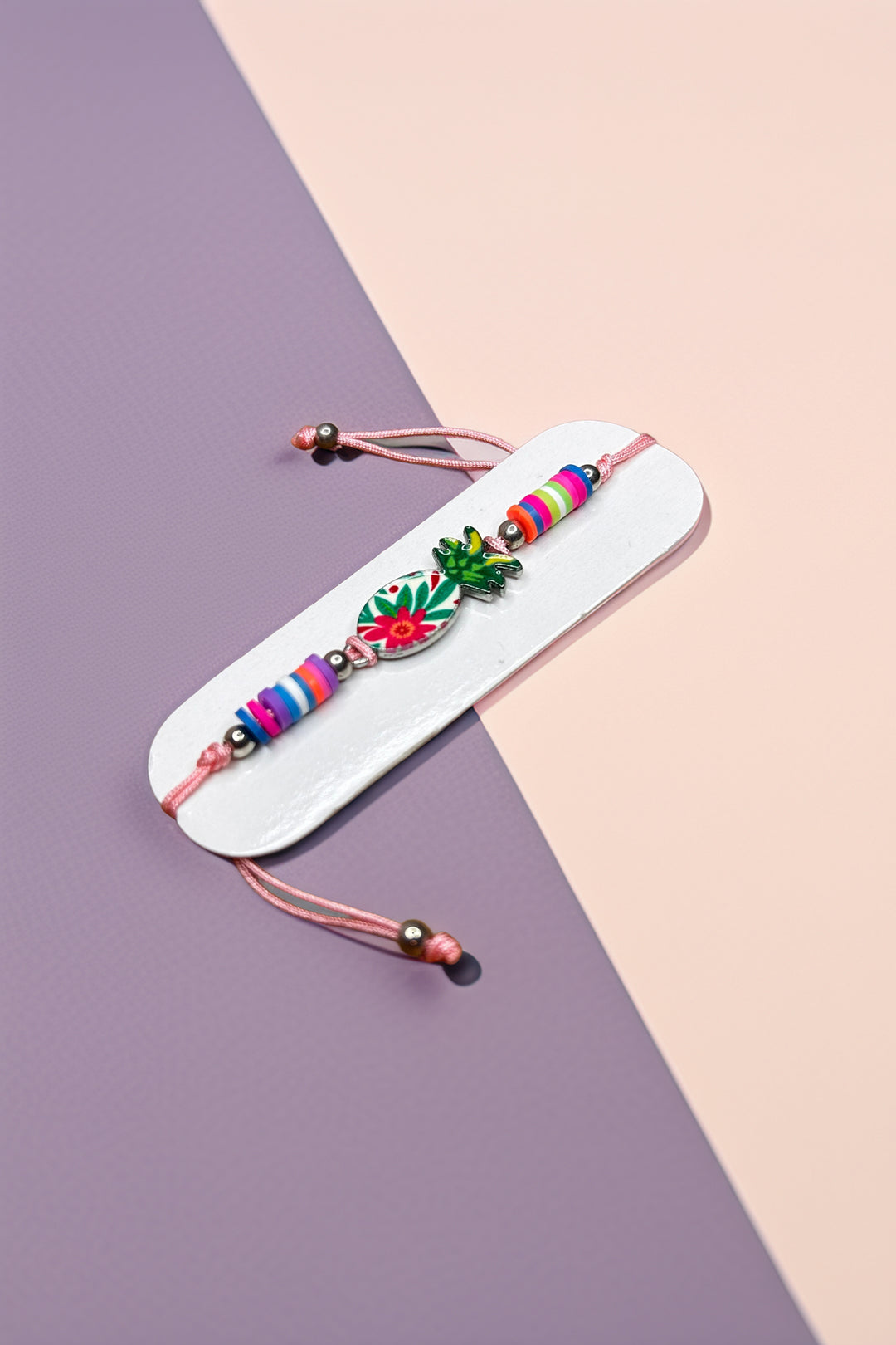 Close-up of bracelet with colorful beads and charms