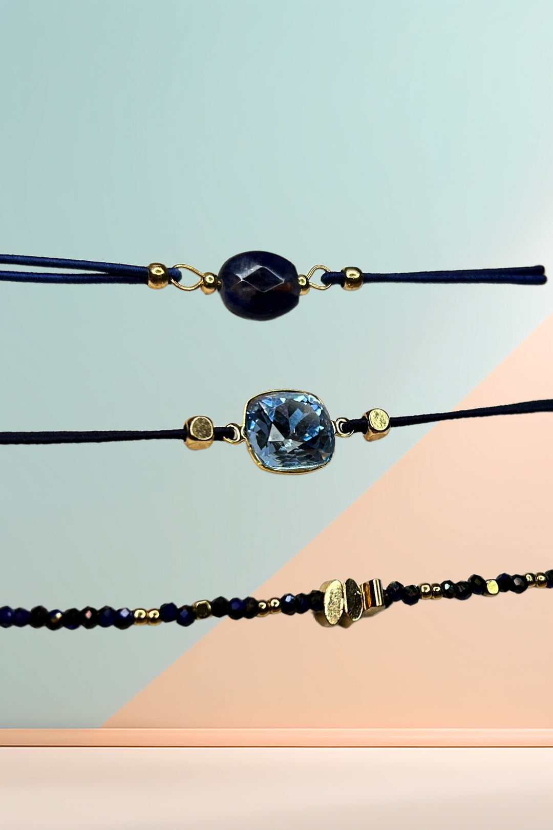 Close-up of bracelet set against a geometric background.