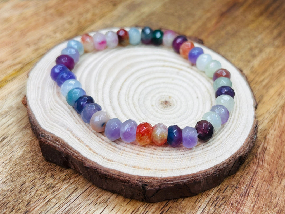 Multicolor bracelet on wooden platform