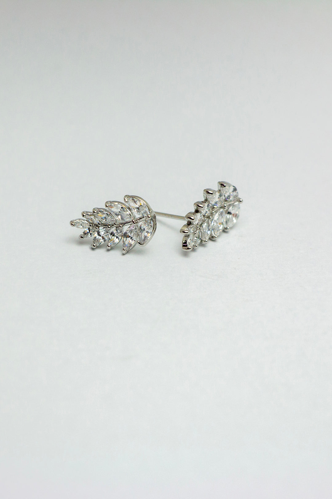 Pair of leaf stud earrings displaying detailed design