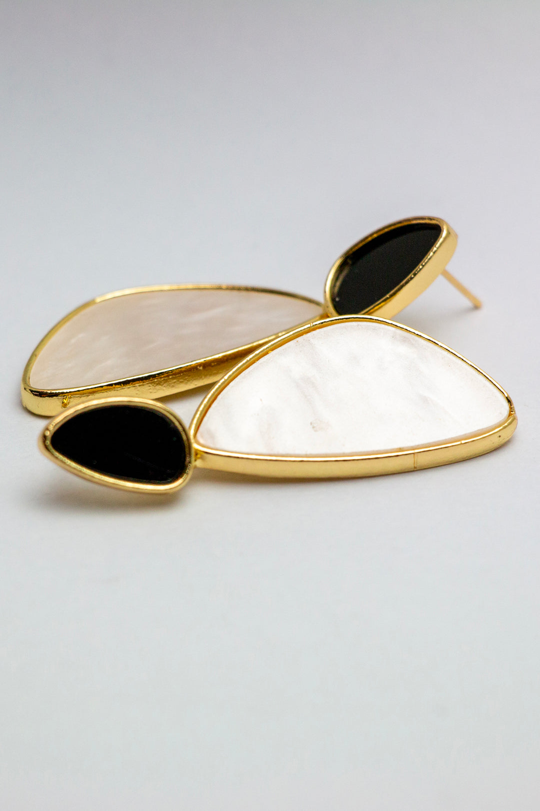 Pair of gold dangle earrings with elegant design