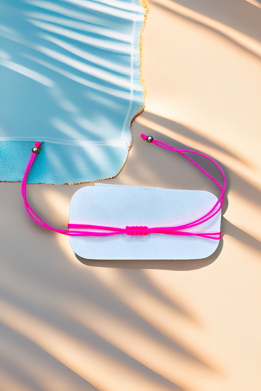 Back view of adjustable pink friendship bracelet