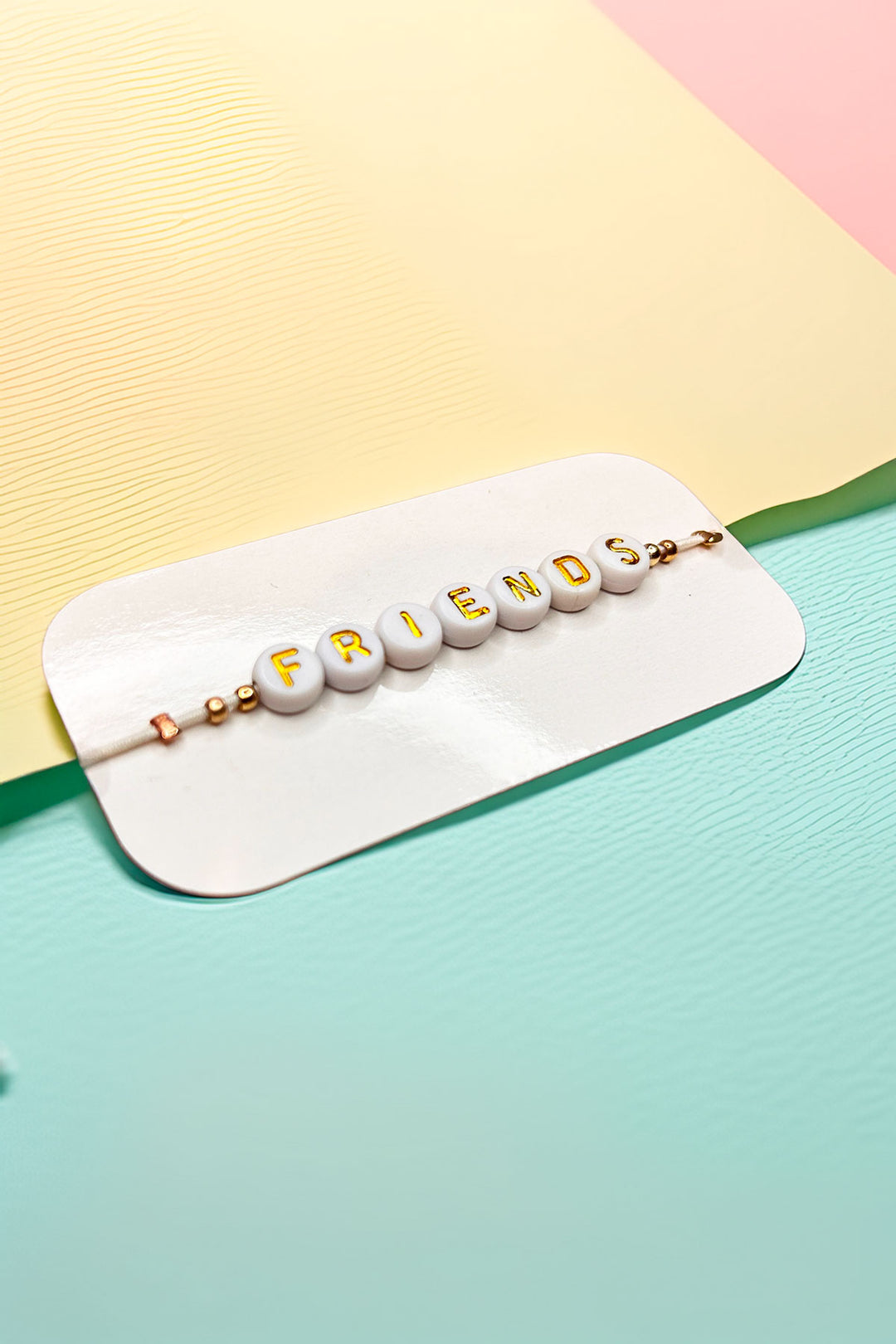 Side view of Friendship Bracelet on packaging