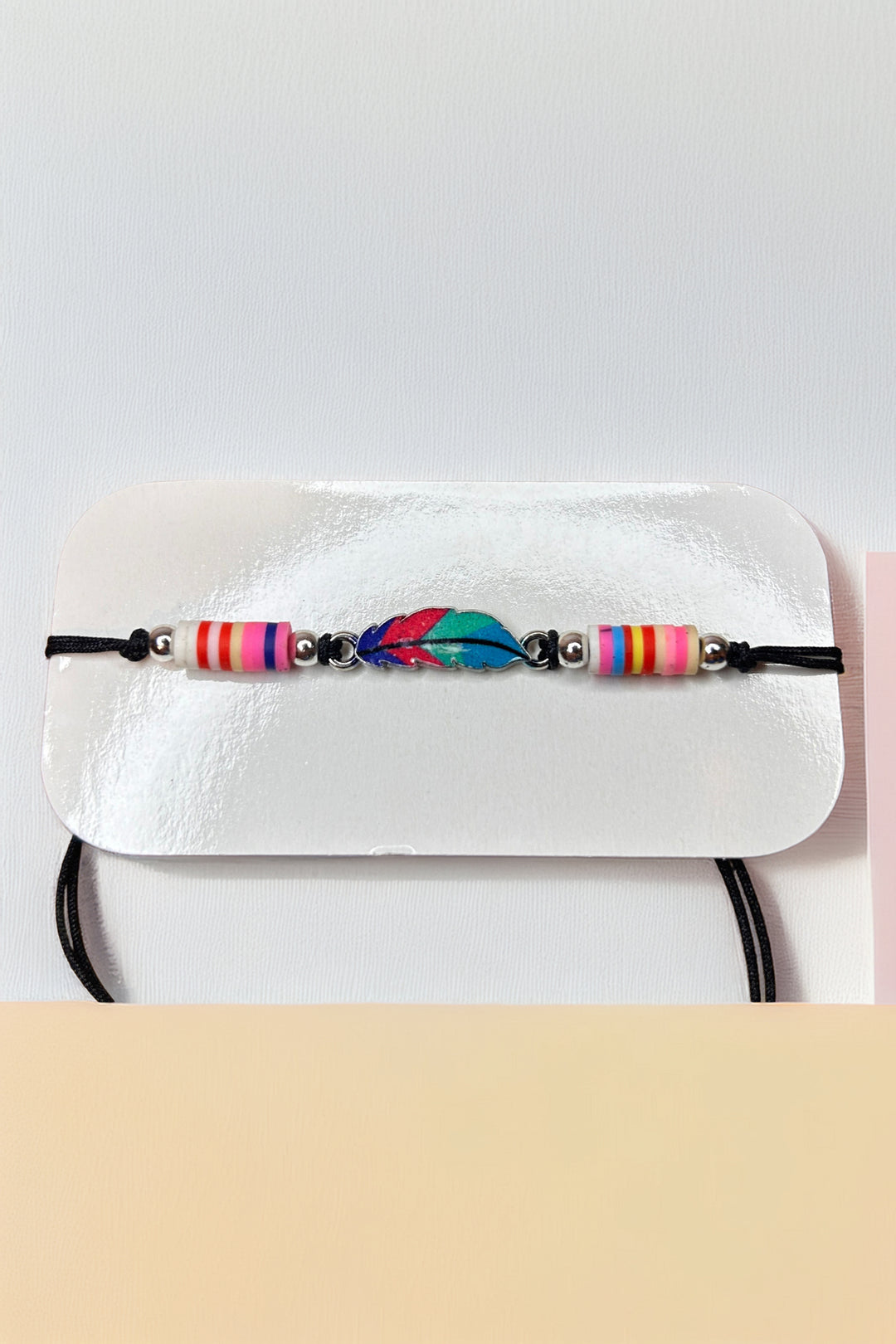 Close-up of colorful striped beads on boho bracelet