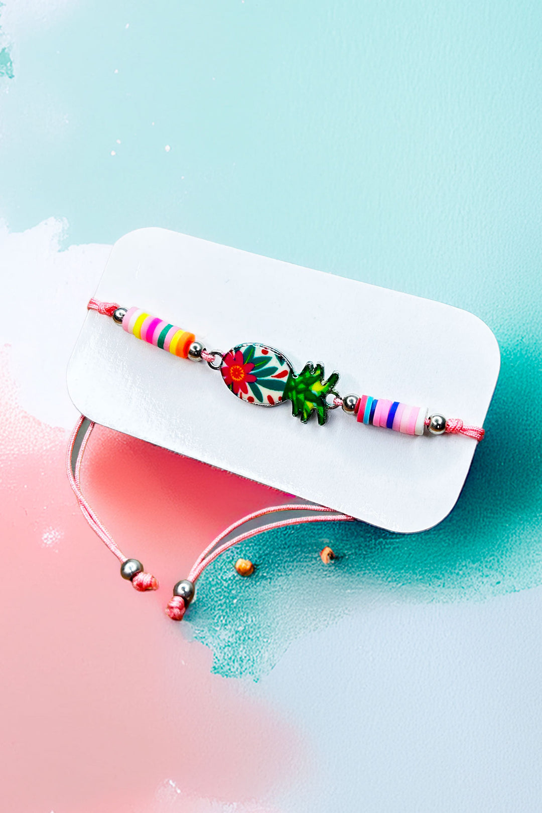 Pineapple friendship bracelet on a card display