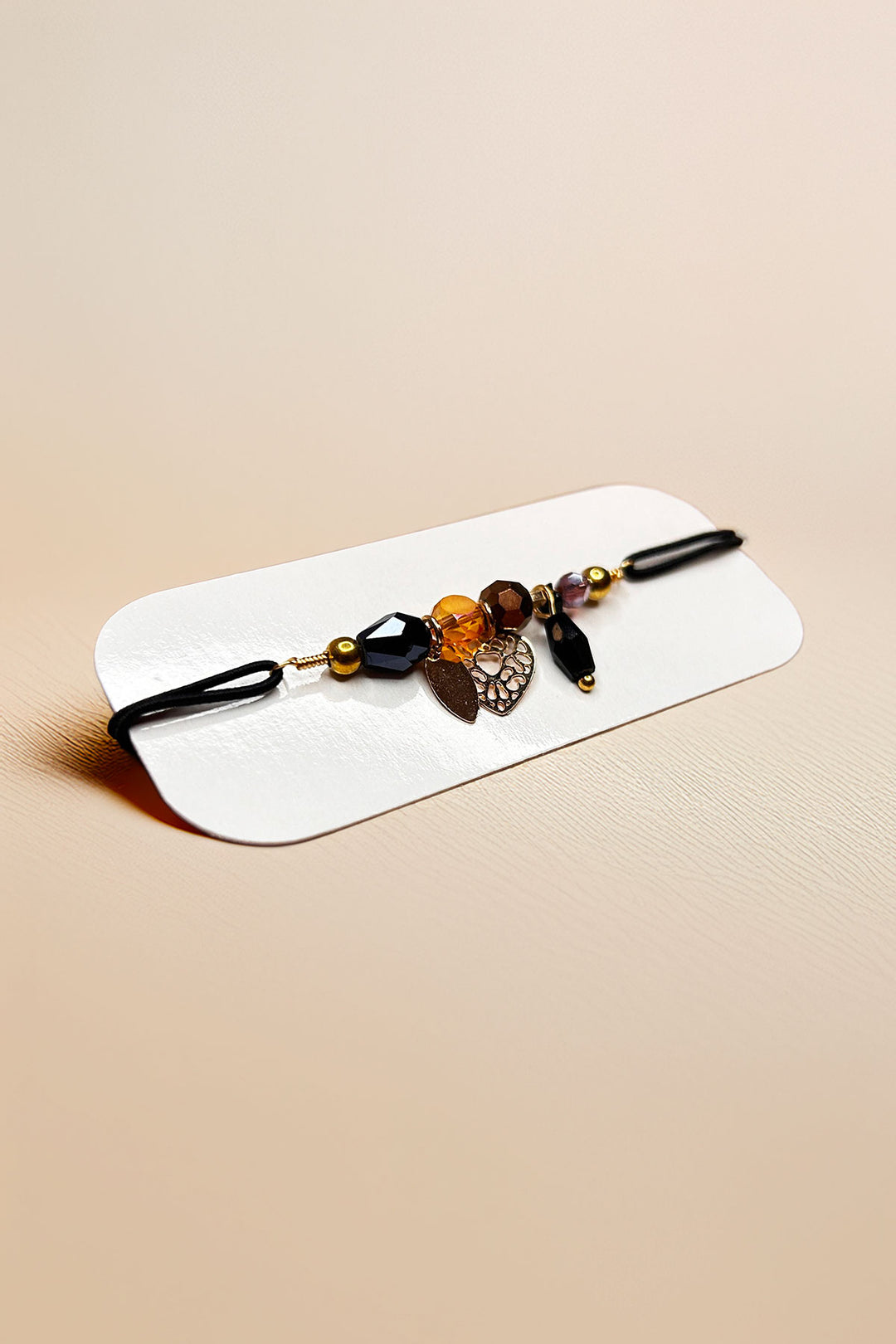 Angled view of bracelet focusing on charm details