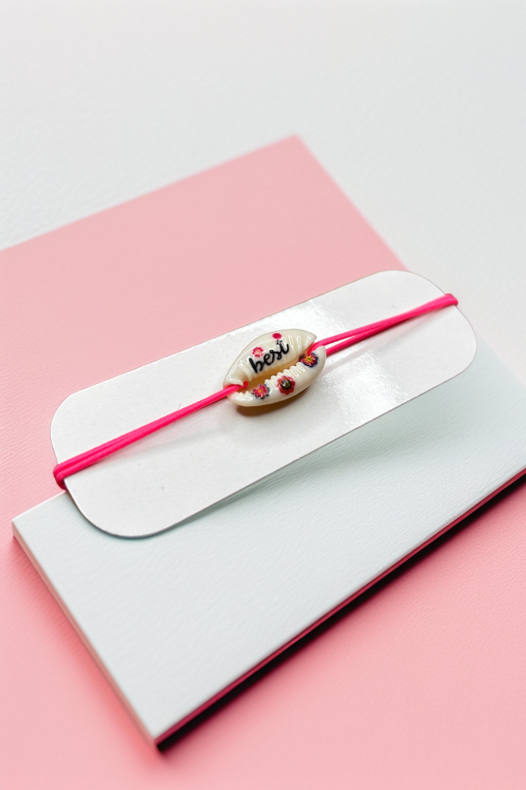 Side angle of pink cord friendship bracelet