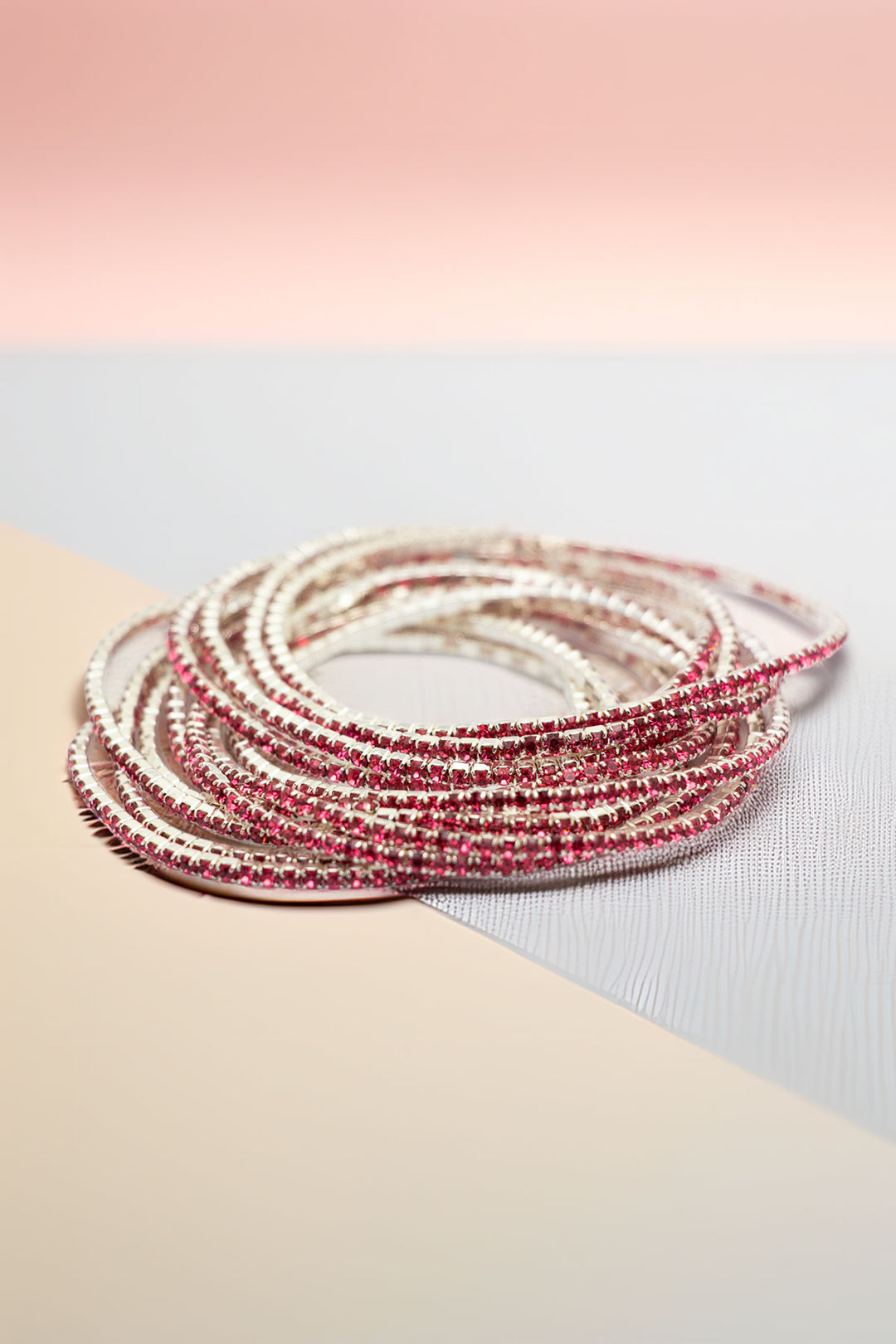 Side angle of stacked rhinestone bracelets