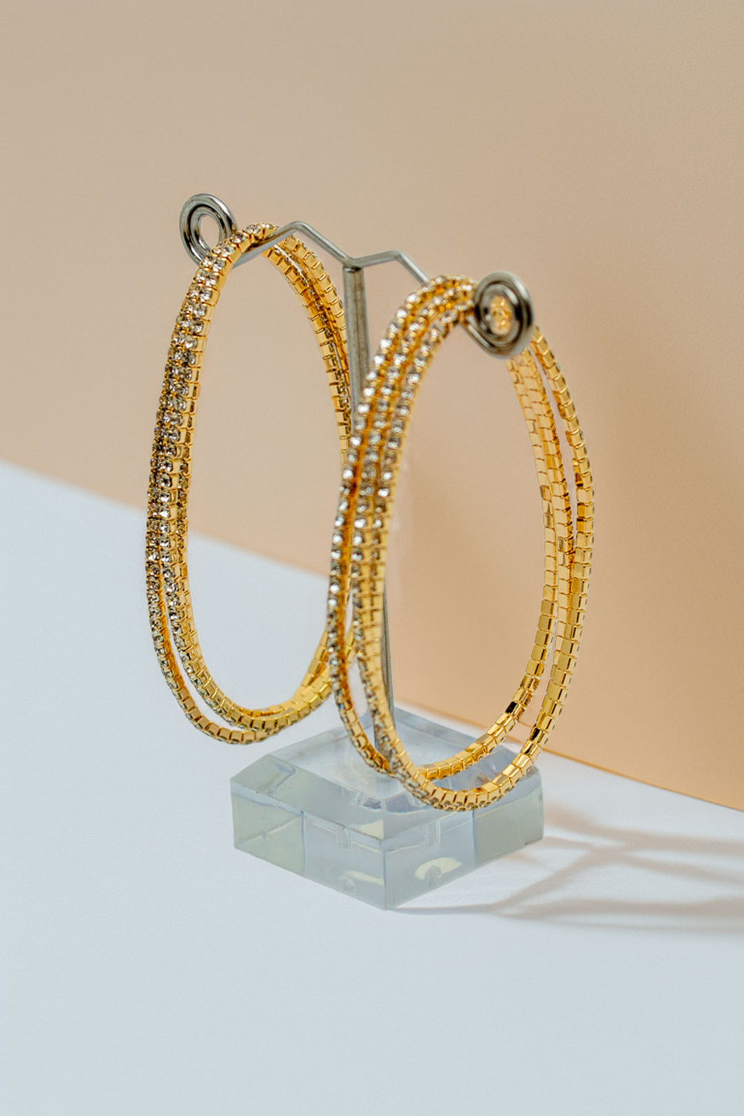 Pair of rhinestone bracelets on stand