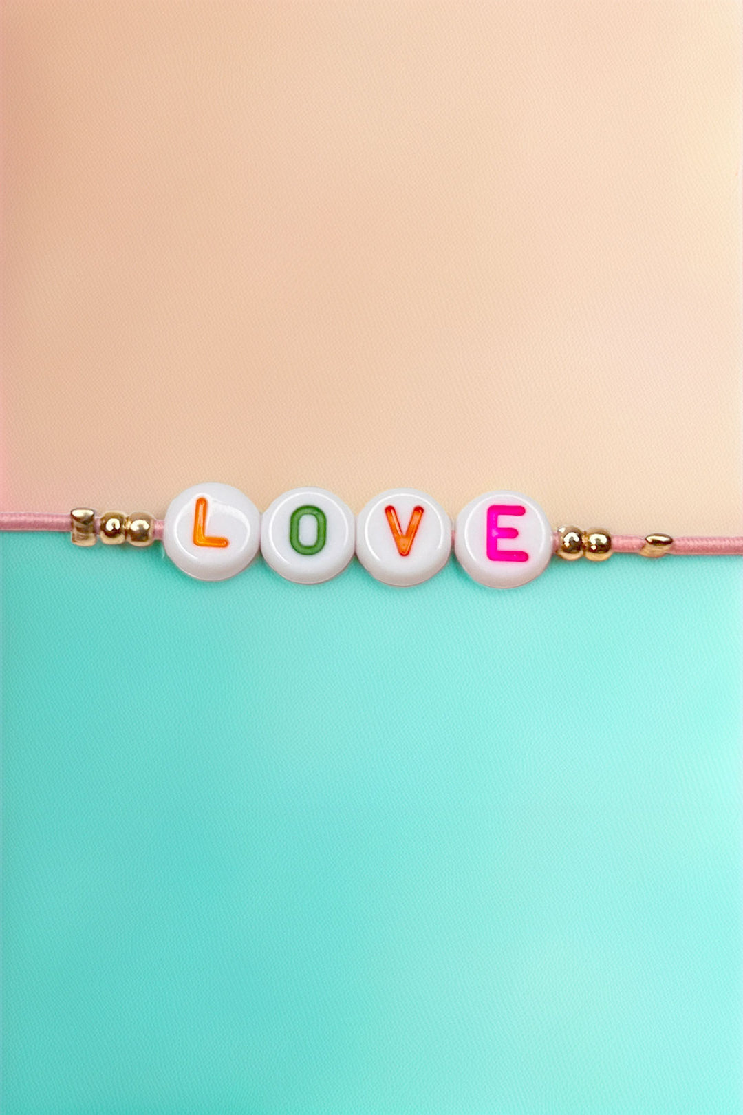 Detailed view of colorful beads spelling LOVE