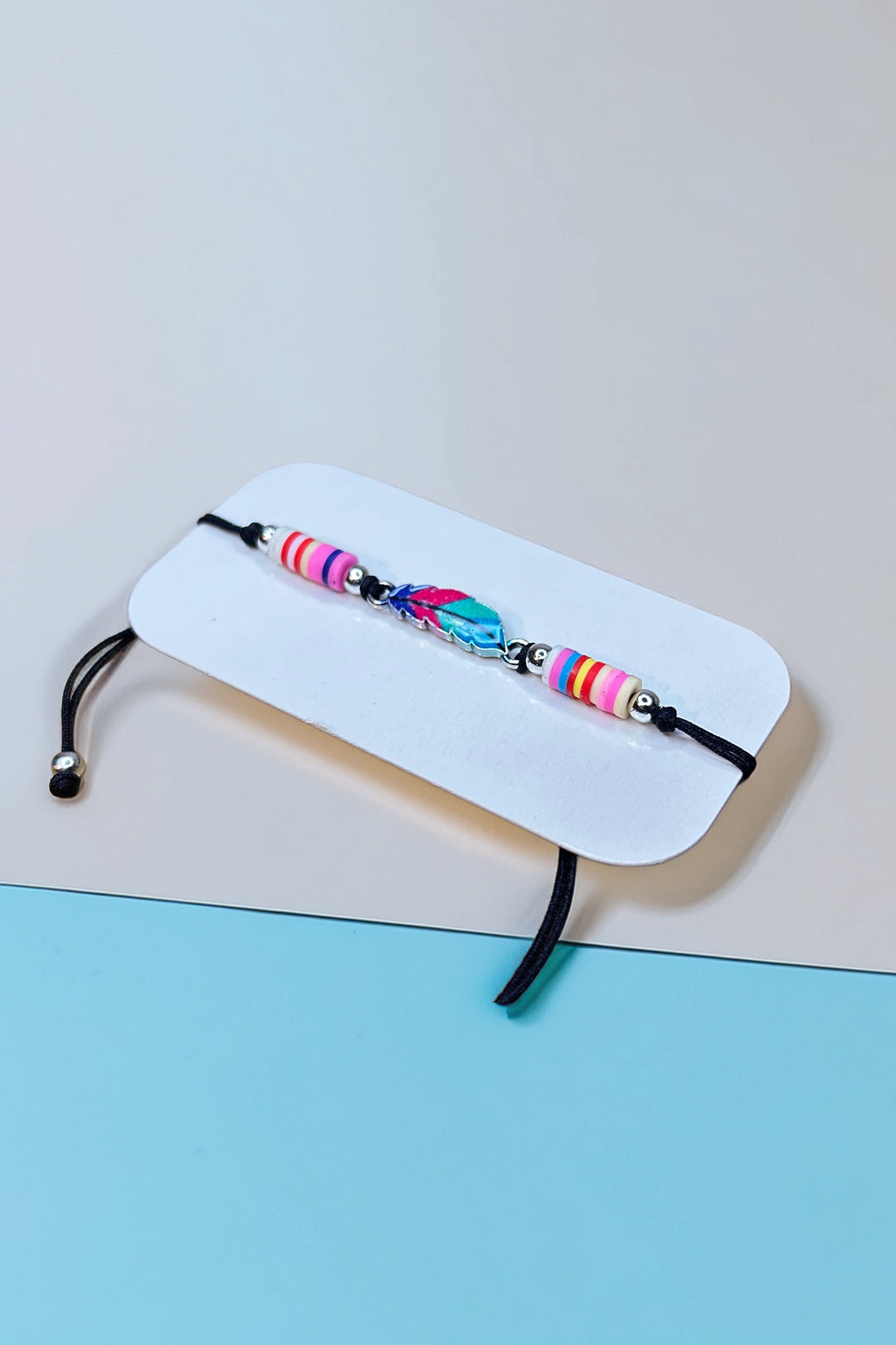 Side angle of boho bracelet with feather charm