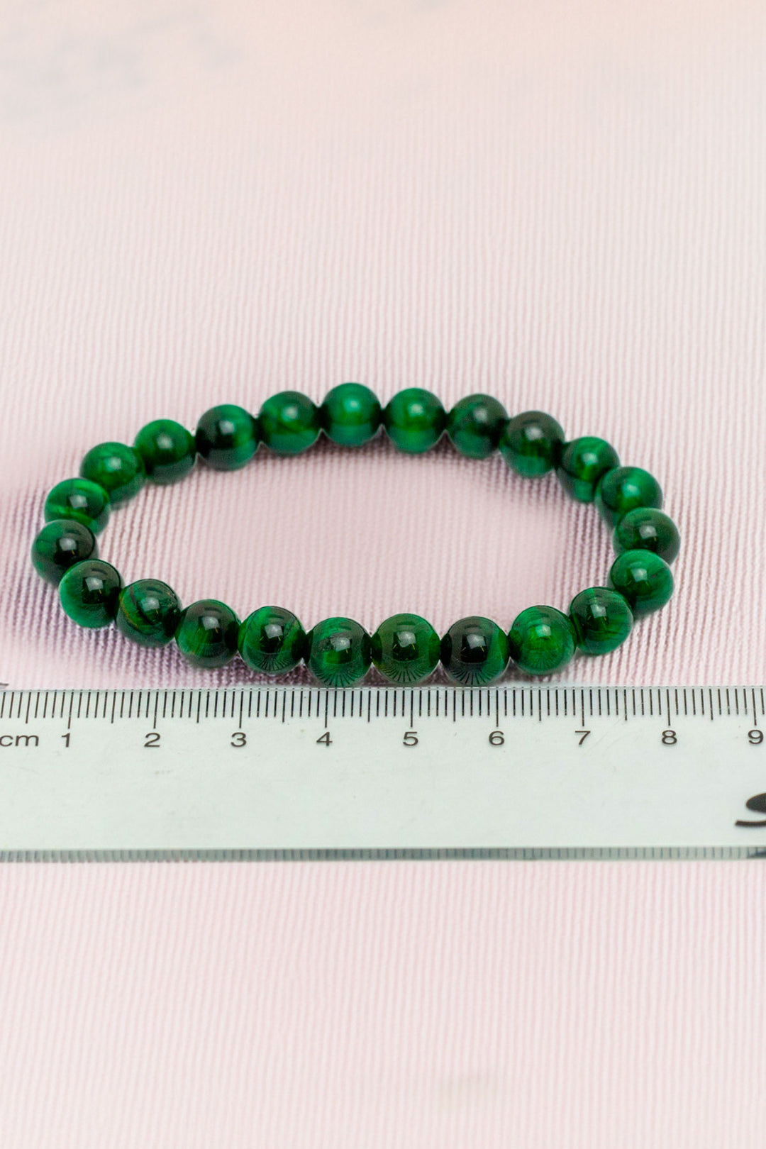 Green beaded bracelet with ruler for precise measurement