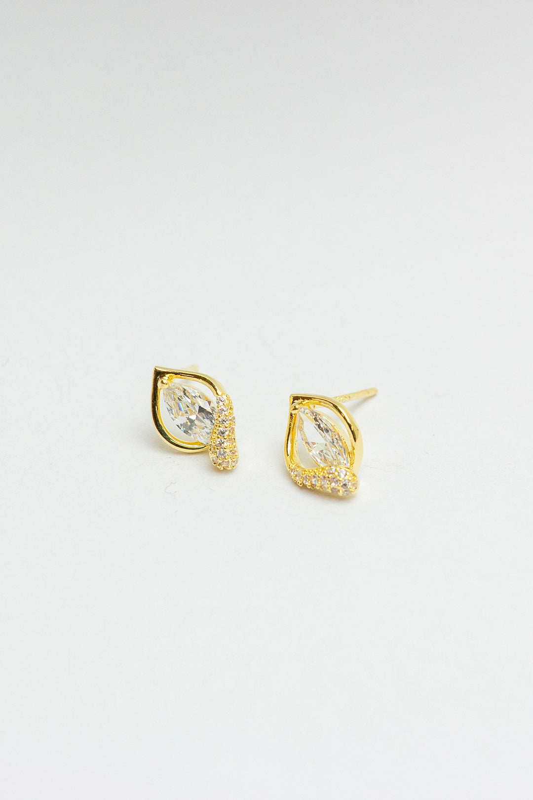 Pair of gold stud earrings front view