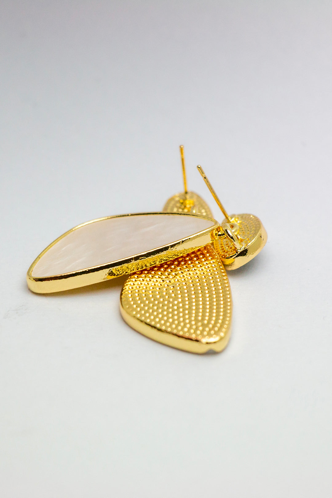 Textured gold finish of earrings