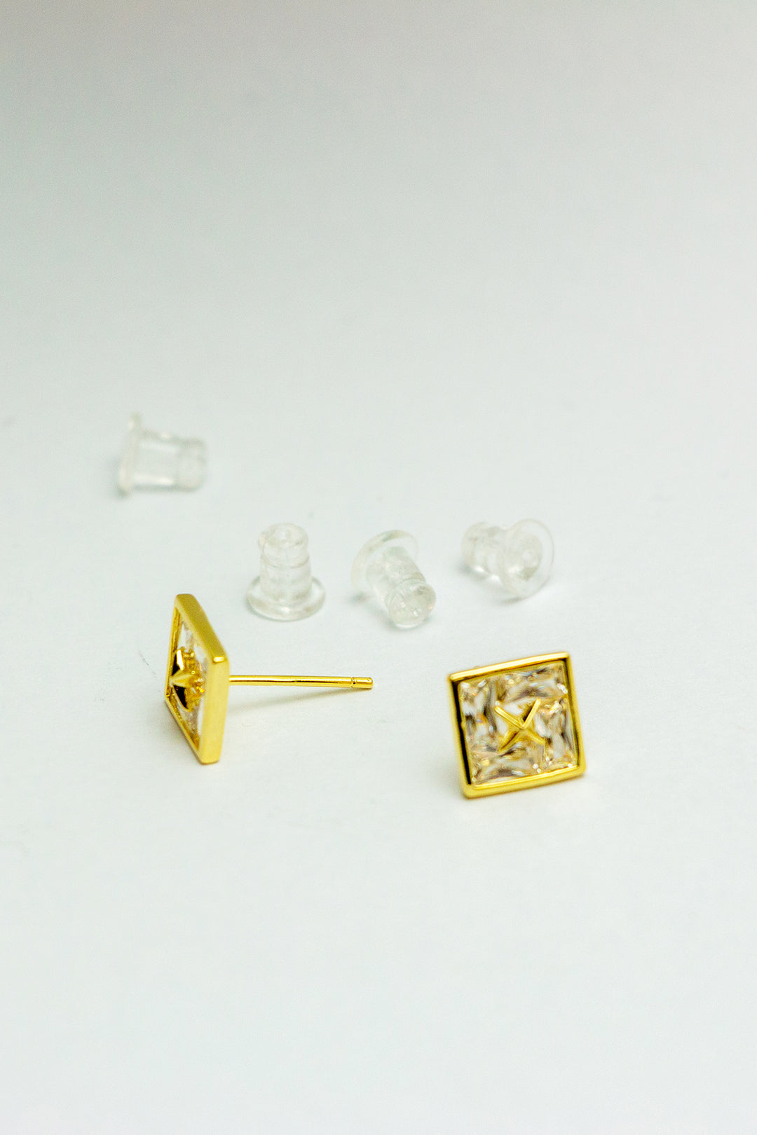Earrings with backings displayed