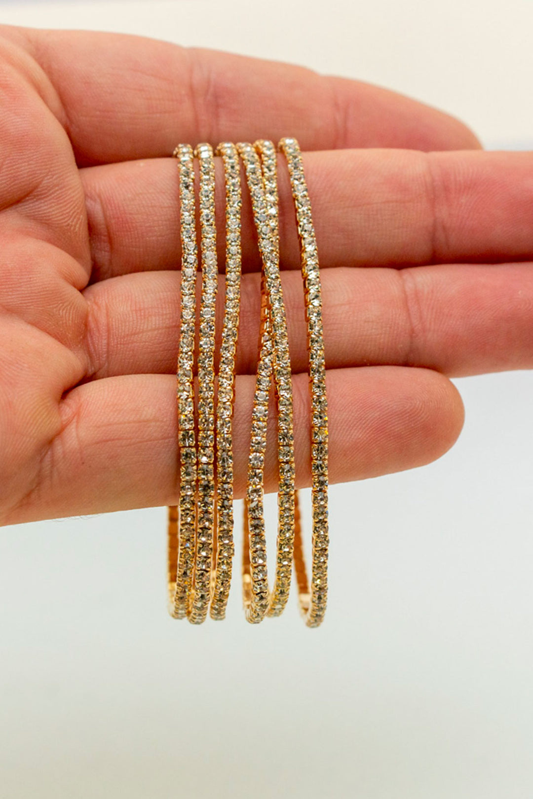 Rhinestone bracelets held in hand