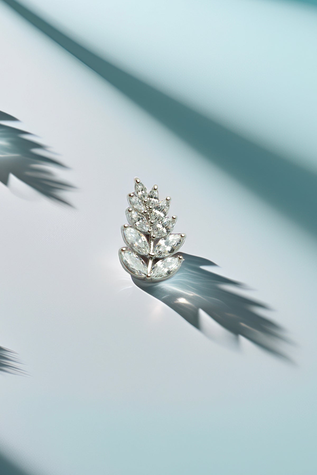 Main view of crystal leaf stud earring with shimmering effect