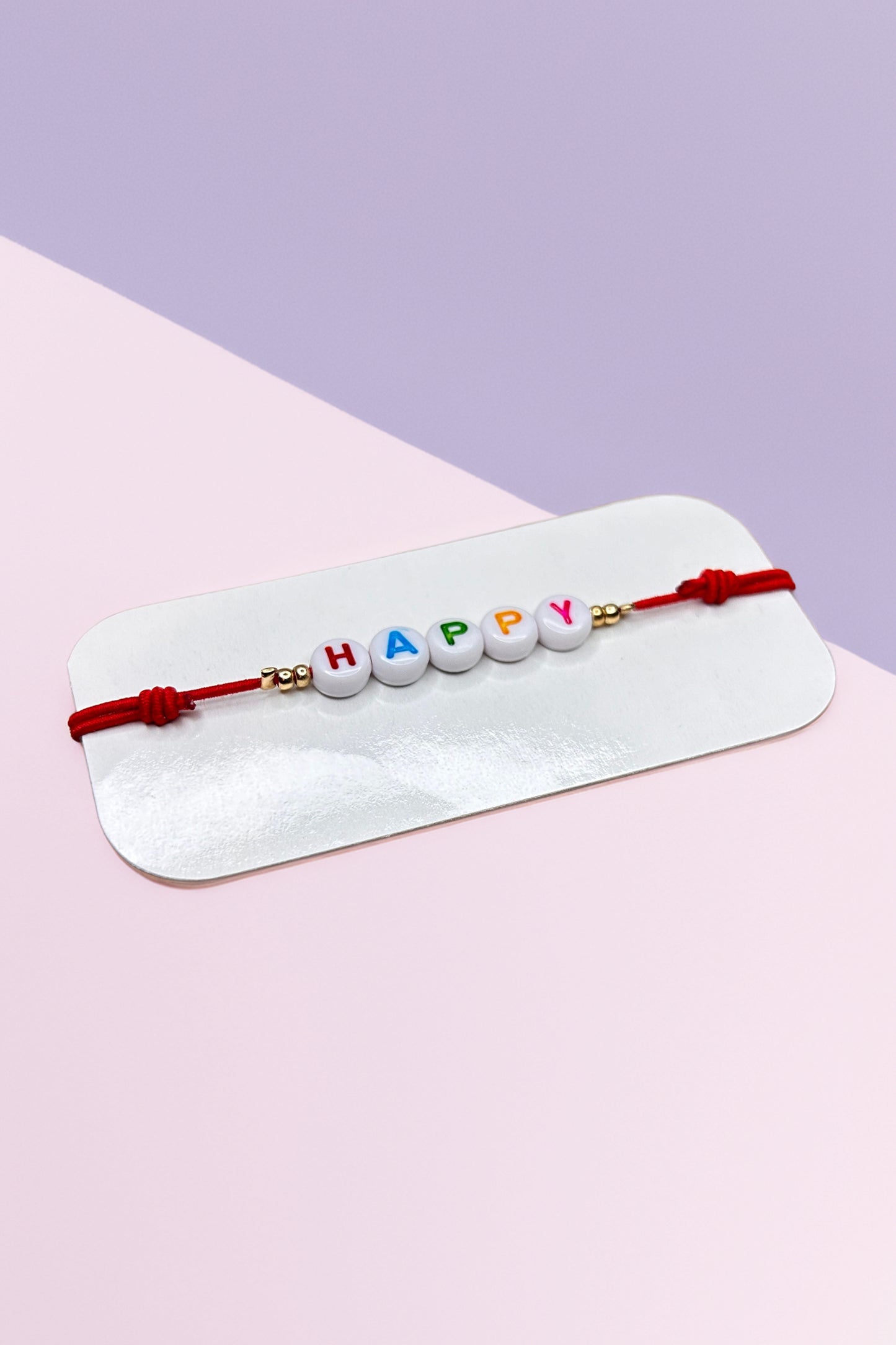 Colorful 'Happy' beaded bracelet on display card