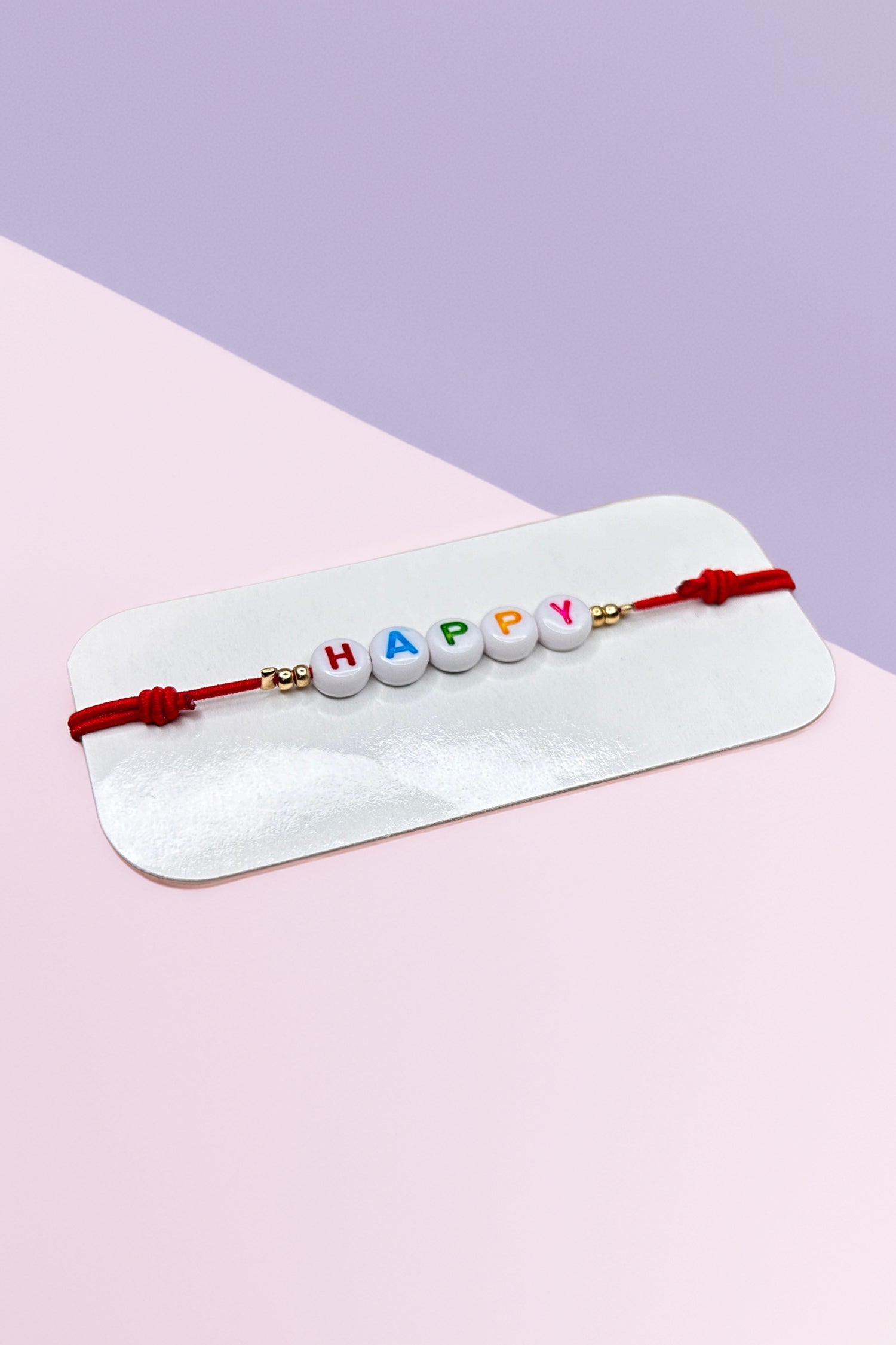 Colorful 'Happy' beaded bracelet on display card
