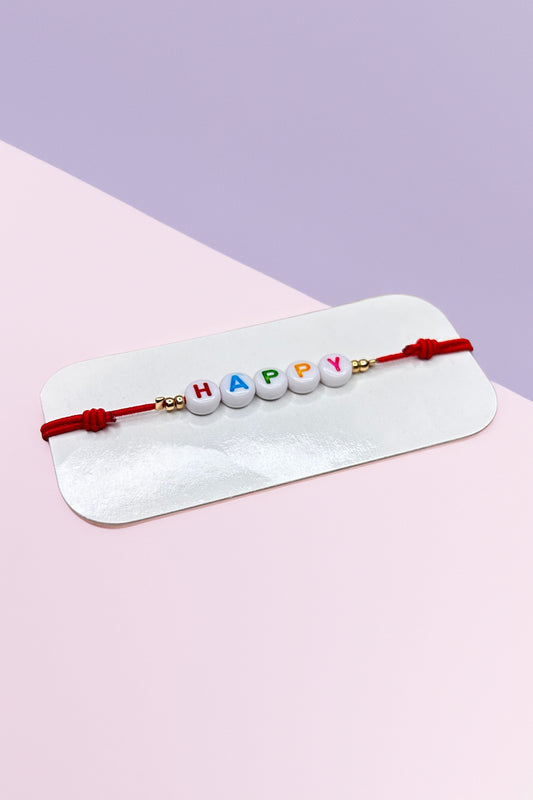 Colorful 'Happy' beaded bracelet on display card