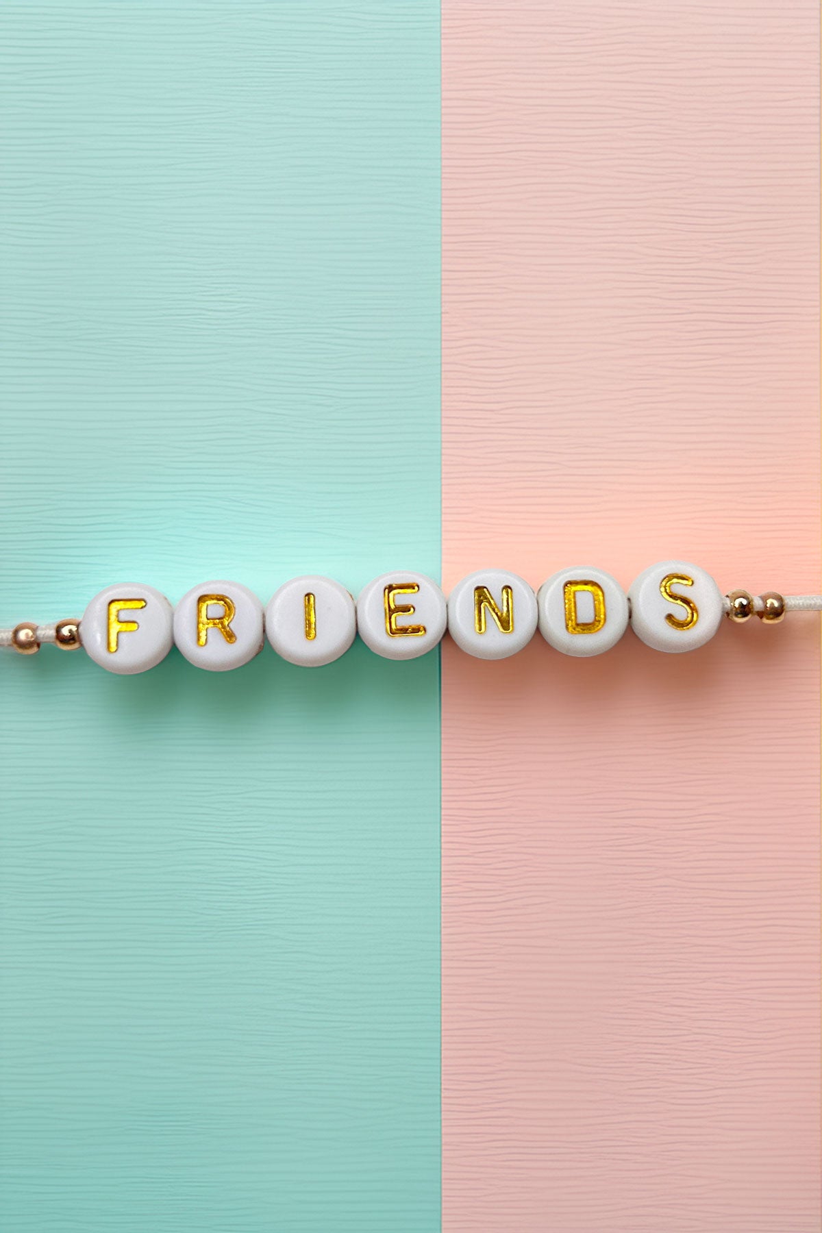 Top view of Friendship Bracelet with 'FRIENDS' in gold letters