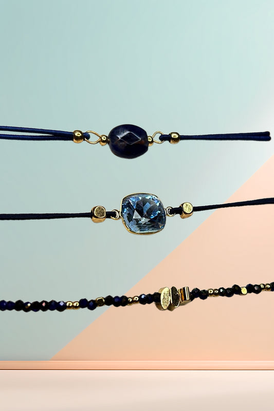 Close-up of bracelet set against a geometric background.