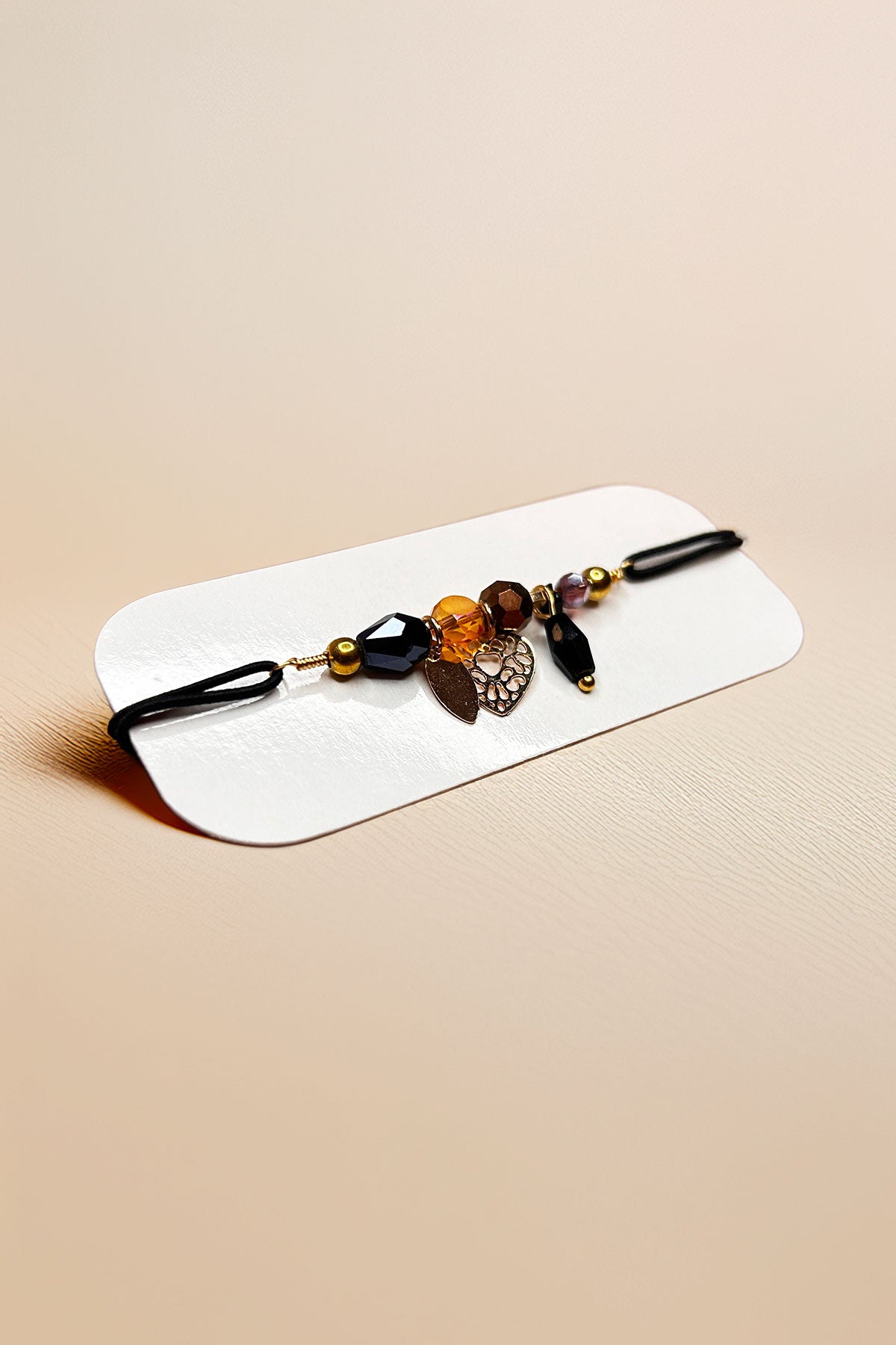 Angled view of bracelet focusing on charm details