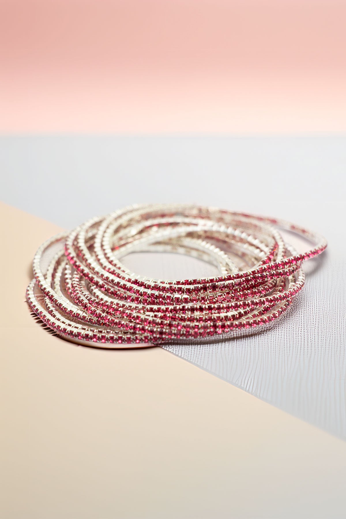 Side angle of stacked rhinestone bracelets