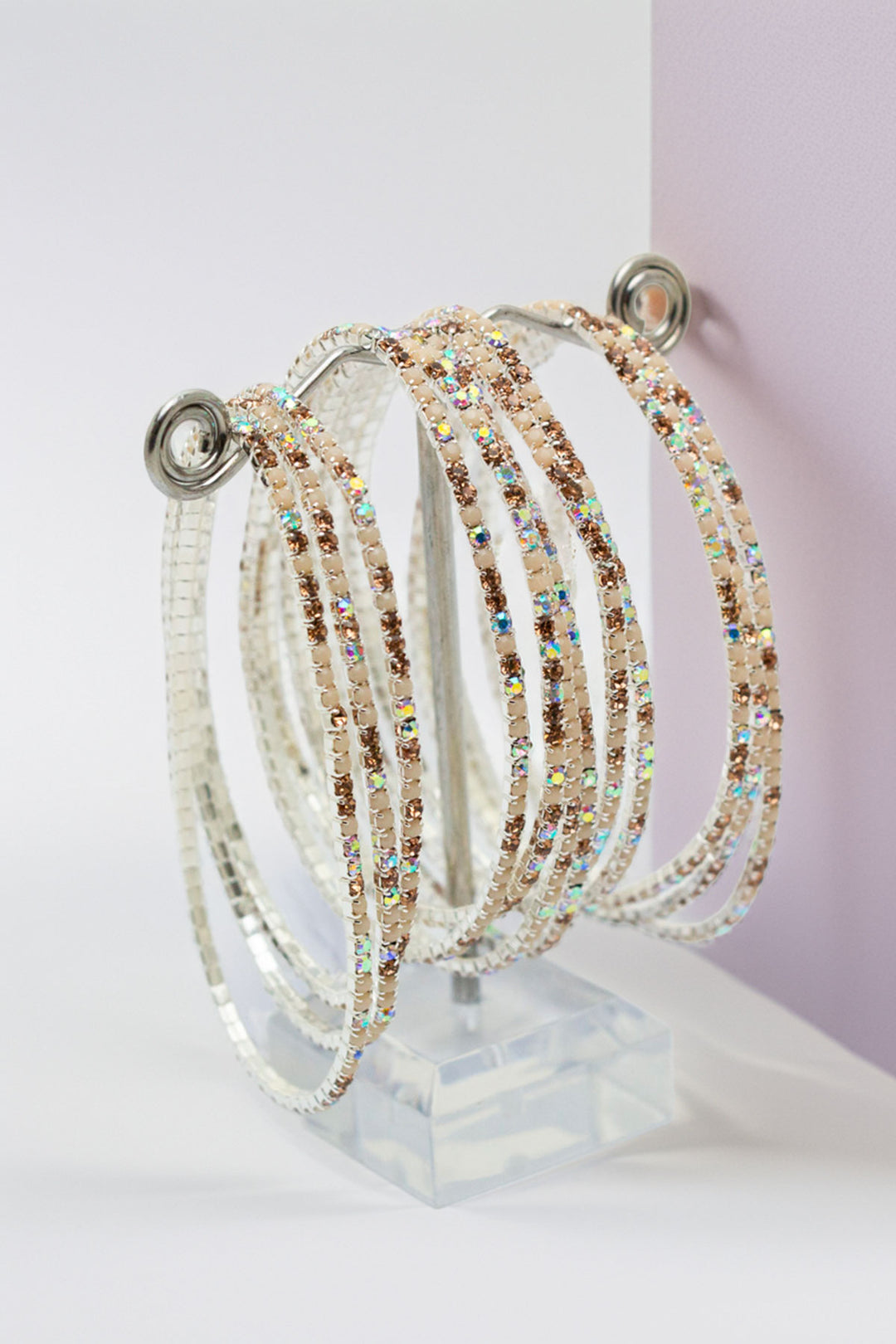 Rhinestone bangles displayed on a clear stand