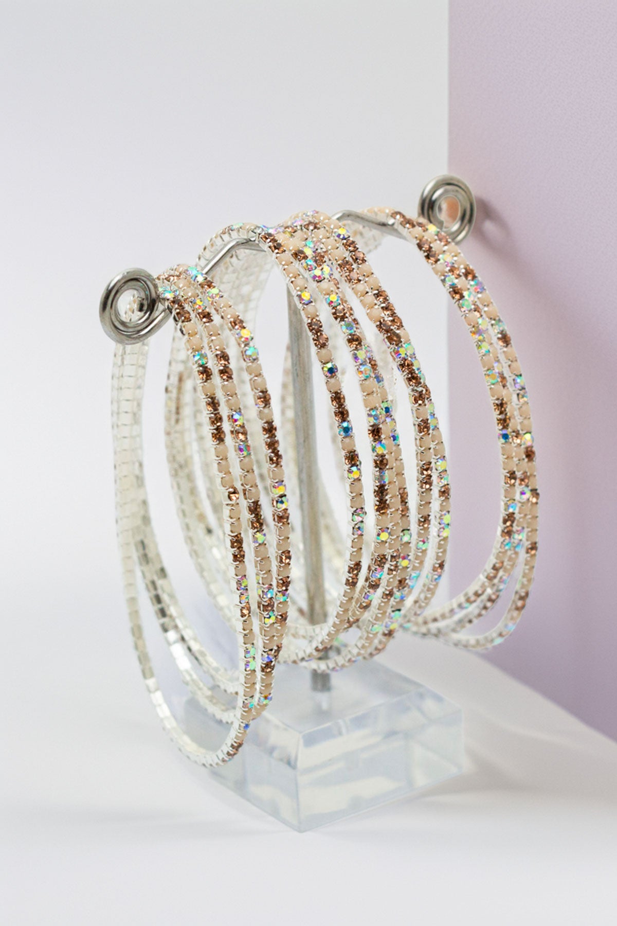 Rhinestone bangles displayed on a clear stand