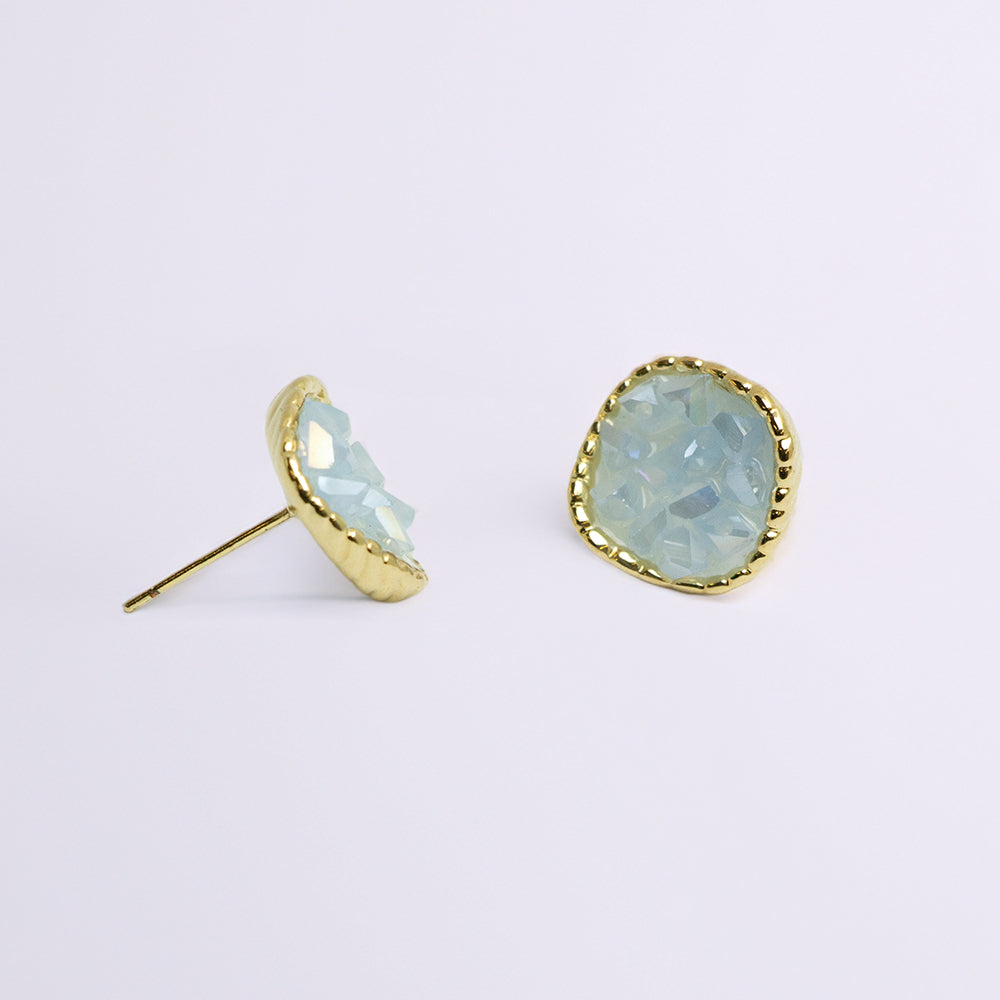 Side angle of opal earrings showing stone depth
