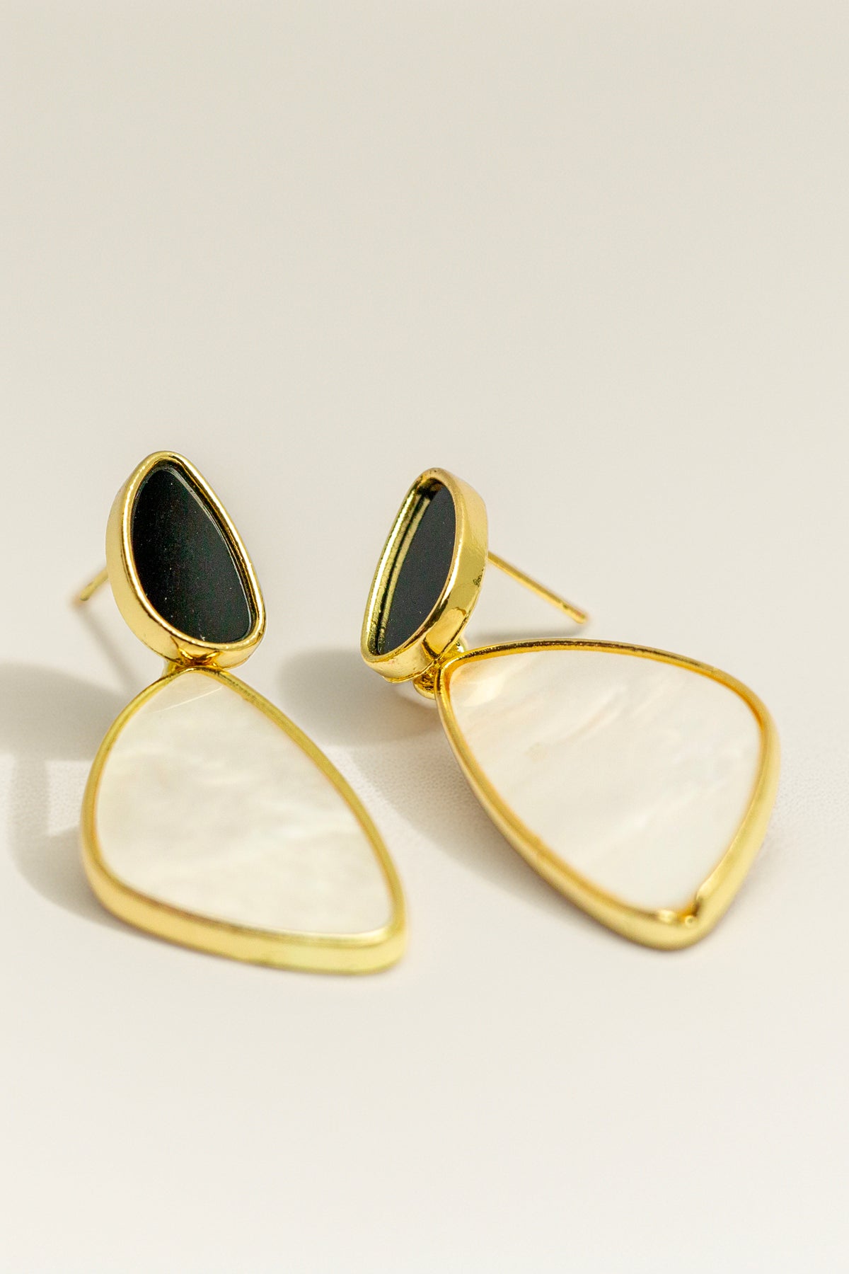 Close-up of gold earring texture and design