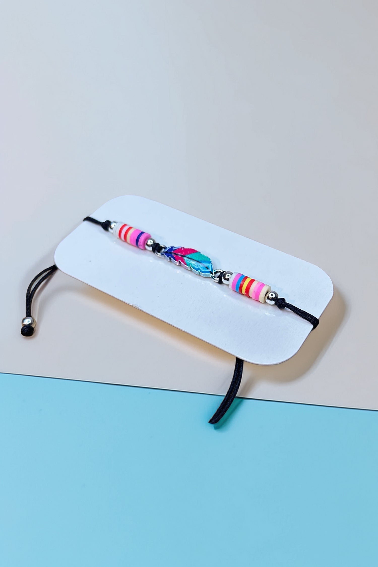 Side angle of boho bracelet with feather charm