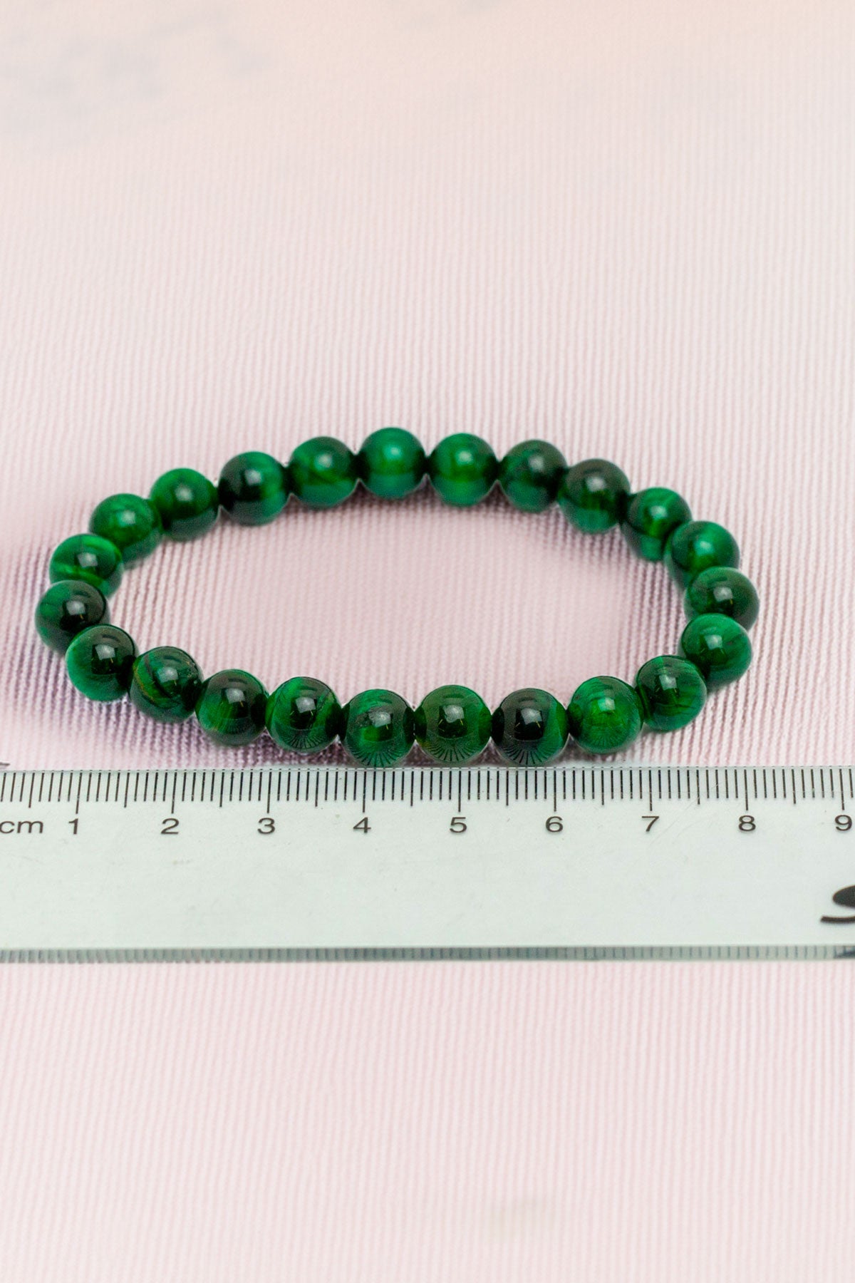 Green beaded bracelet with ruler for precise measurement