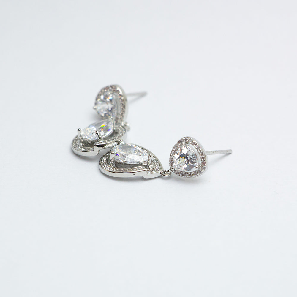 Side view of teardrop dangle earrings